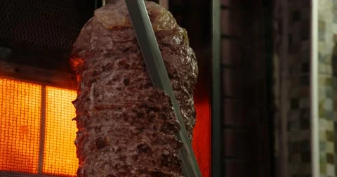 Cutting a slice of  Turkish Doner Kebab 스톡 동영상 54597746