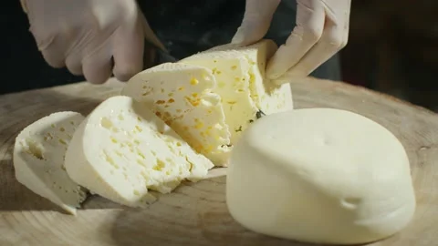 Cutting slices of cheese Stock Footage 138127084