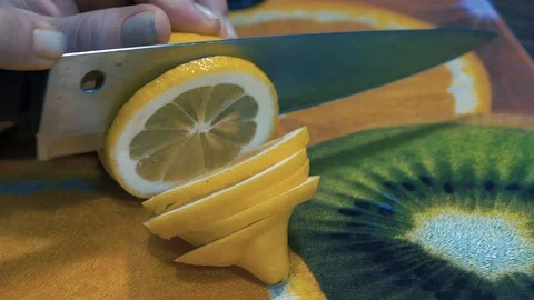 Cutting slices of fresh lemon Stock-Footage 88002068