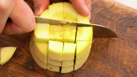 Cutting slices of the fresh light yellow vegetable marrow Stock-Footage 248442225