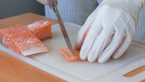 Cutting slices of salmon for sushi Stock Footage 104883754