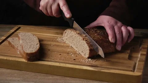 Cutting slices of wholemeal bread Stock Footage 173196084