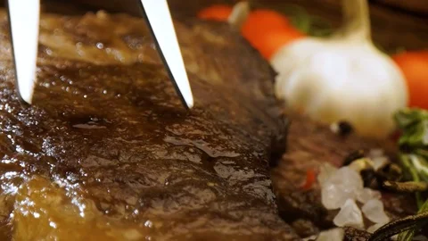 Cutting, slicing medium rare meat grilled barbecue steak with knife Stock Footage 115829883