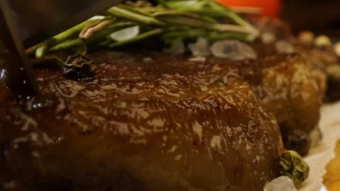 Cutting, slicing medium rare meat grilled barbecue steak with knife Stock Footage 115830216