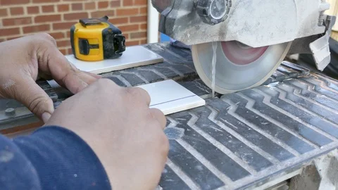 Cutting a small ceramic tile - close-up 4K Stock Footage 97607851