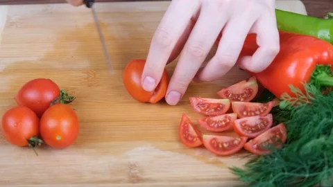 Cutting small tomato Stock Footage 232874226