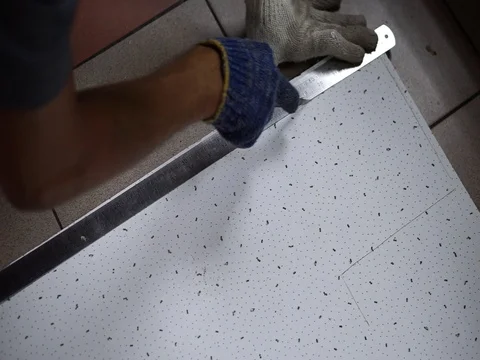 Cutting off a soft board using a knife and a steel ruler. Stock Footage 93607435