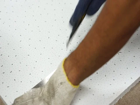 Cutting off a soft board using a knife and a steel ruler. Stock Footage 93825785