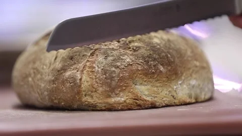 Cutting sourdough bread in a cutting board 動画素材 133205617