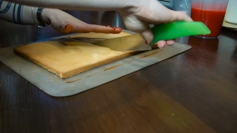 Cutting a square cake with a knife Stock Footage 91549071