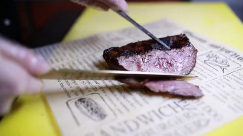 Cutting steak with a knife Stock Footage 73486369