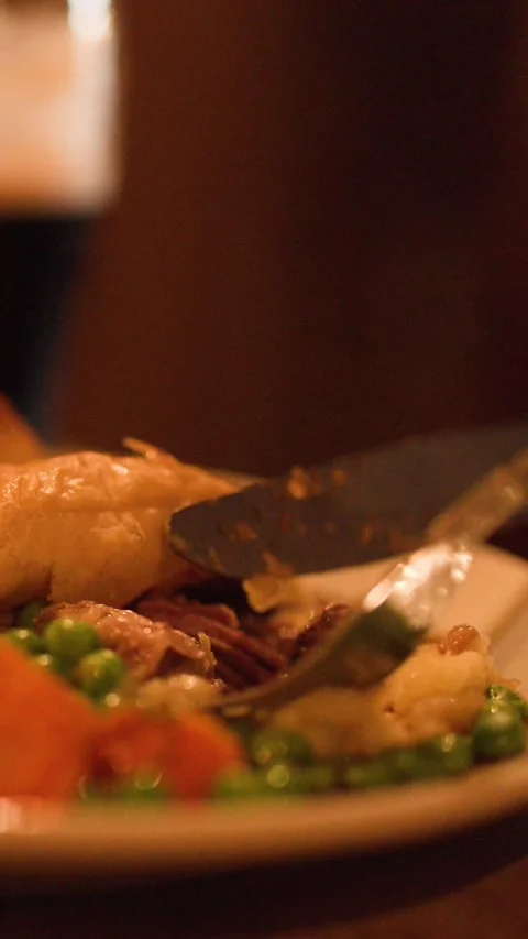 Cutting Into Steak Pie Dinner in Cozy Restaurant Setting Stock Footage 317538388