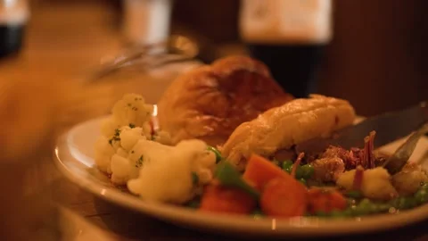Cutting Into Steak Pie with Vegetables in Cozy Restaurant Setting Stock Footage 318580164