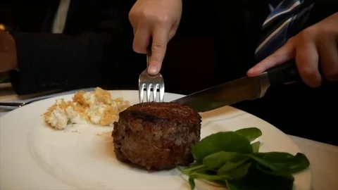 Cutting Steak at Upscale Restaurant Stock Footage 81367817