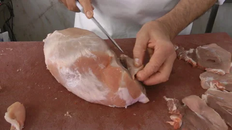 Cutting steaks at the butcher Stock Footage 42228760