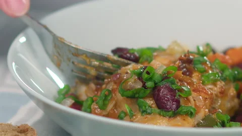 Cutting stewed chicken thighs Stock Footage 165793409