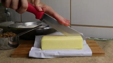 Cutting a stick of butter Stock Footage