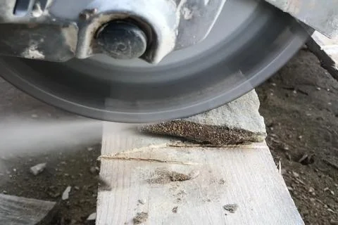 Cutting the stone facing with the help of an abrasive disc of co Stock Photos