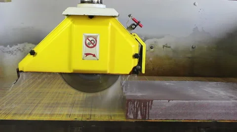 Cutting stone, worker come close and inspect it. Stock Footage 39987829