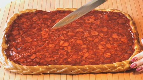 Cutting of a strawberry pie using a steel knife Stock Footage 64577134