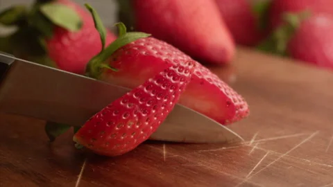 Cutting strawberry in slow motion Stock Footage 156202391
