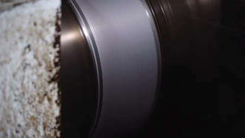 The cutting string for metal is wound on a round shaft. Machine in work in the Stock Footage 116442600