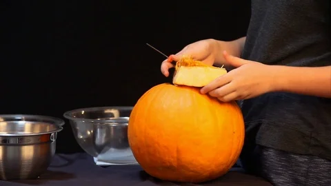 Cutting Strings Off Of Pumpkin Lid B Stock Footage 97671923