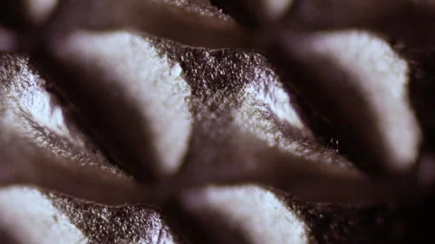 The cutting surface of a metalworking file under a microscope. High-strength Stock Footage 268489524