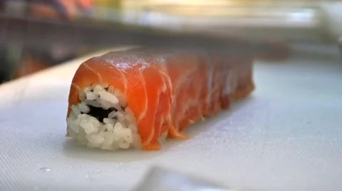 Cutting sushi rolls Stock Footage 64673332
