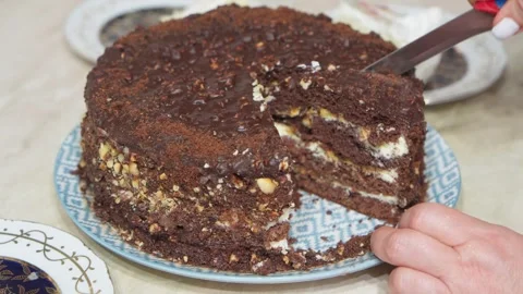 Cutting sweet chocolate cake with kitchen knife. Stock Footage 254658967