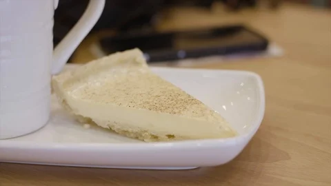 Cutting Taking A Bit Of A Custard Tart Slice With A Spoon In A Cafe Stock Footage 97646325