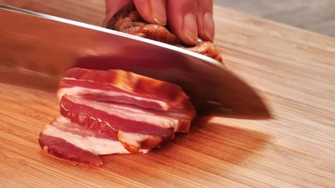 Cutting tasty bacon with knife. Stock Footage 119835643