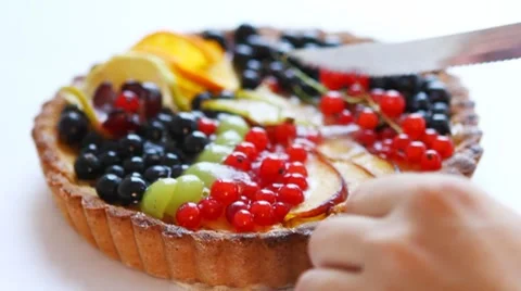 Cutting tasty fruitcake Stock Footage