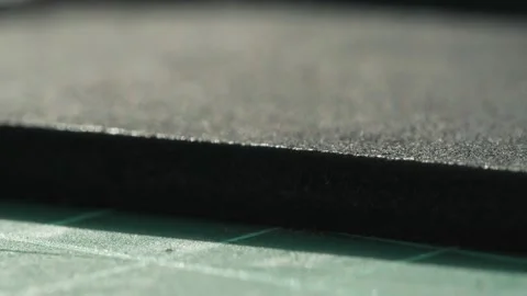 Cutting thin line on black leather with sharp knife close-up. Craftsman carving Stock Footage 157374617