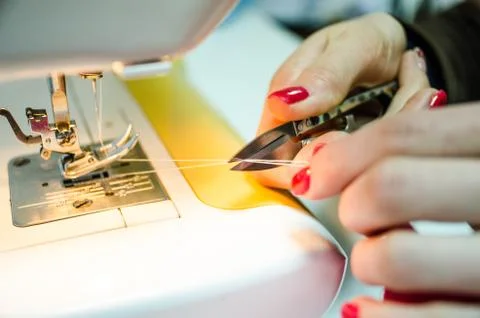 Cutting the thread after sewing, Cutting the thread after sewing Stock Photos