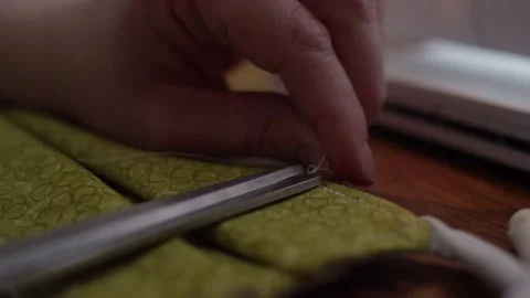 Cutting thread on homemade mask Stock Footage 146924043