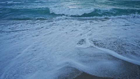 Cutting through blue waves.. Surfing the sea. Wave cutter. Ocean in motion Stock Footage 314413857