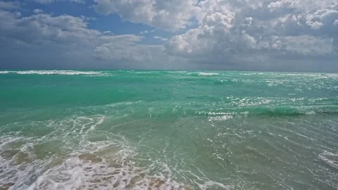 Cutting through waves.. Surfing the sea. Wave cutter. Ocean in motion. Scenic Stock Footage 306432861