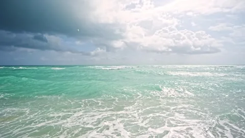 Cutting through waves.. Surfing the sea. Wave cutter. Ocean in motion. Scenic Stock Footage 314413676