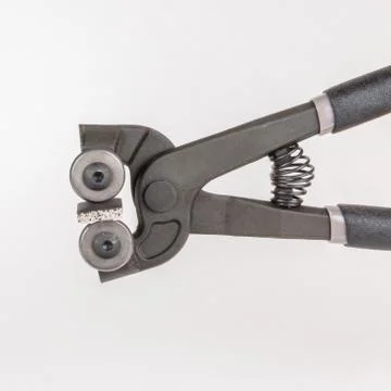 Cutting of tile with nipper Stock Photos