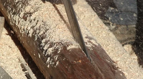 Cutting timber onto halves using chainsaw Stock Footage 57273835