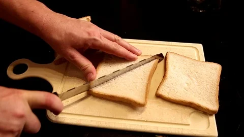 Cutting Toast Bread on Triangles Video stock 90951478