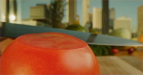 Cutting tomato macro shot, sliding over cooking table Stock Footage 126301842