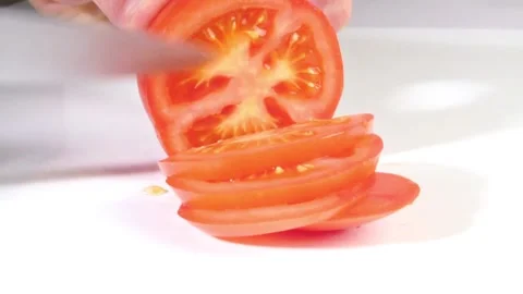 Cutting Tomato in Slices 50FPS Stock Footage 276769014