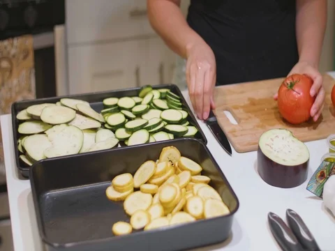 Cutting a tomato in slow motion Stock Footage 80544984