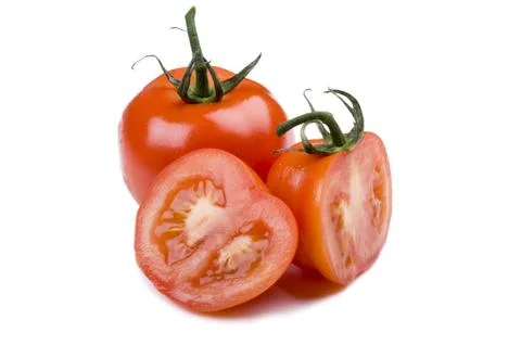 Cutting tomato on white Foto stock