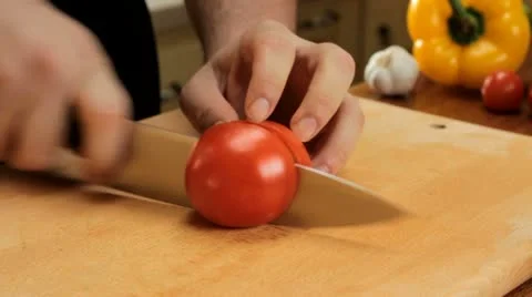 Cutting tomatoes Stock Footage 12766660