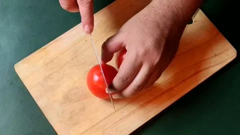 Cutting tomatoes. Stock Footage 203902843
