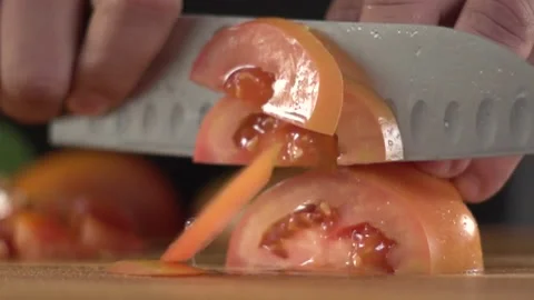 Cutting tomatoes to make the salad Stock Footage 160622277