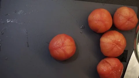 Cutting tomatoes overhead Stock Footage 121118284